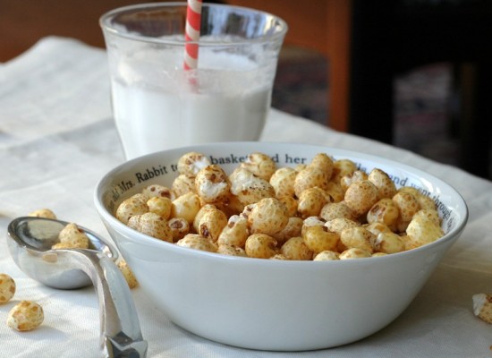 Bowl of corn pops and glass of coconut milk