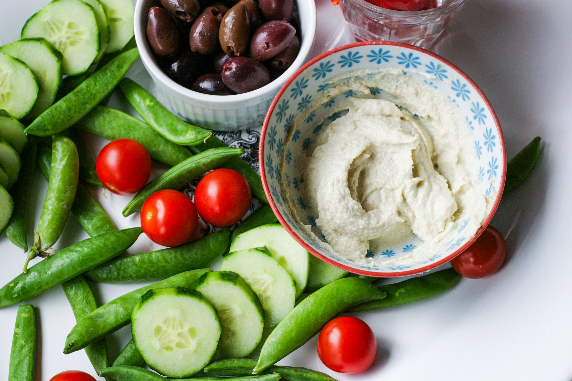 Hummus made with cashew and veggies on plate