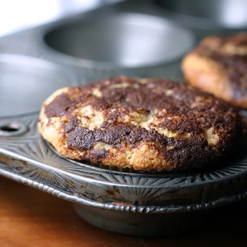 Cinnamon Bun Muffins muffin top in tin image