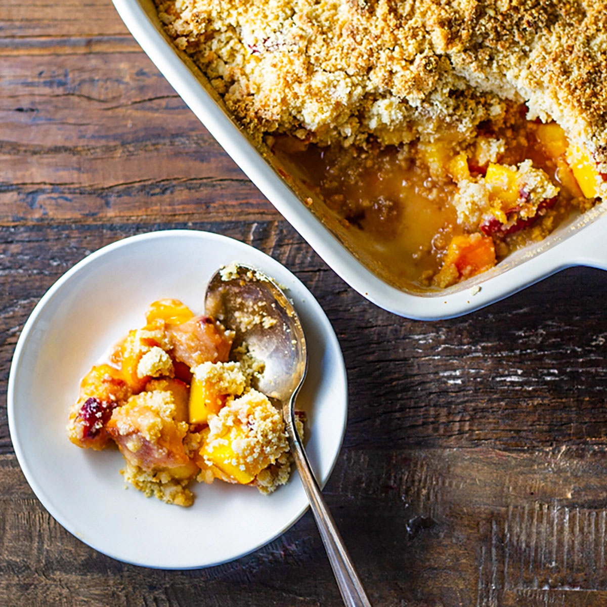 Peach Crisp in bowl with spoon