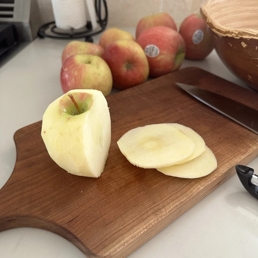 Apples being sliced image