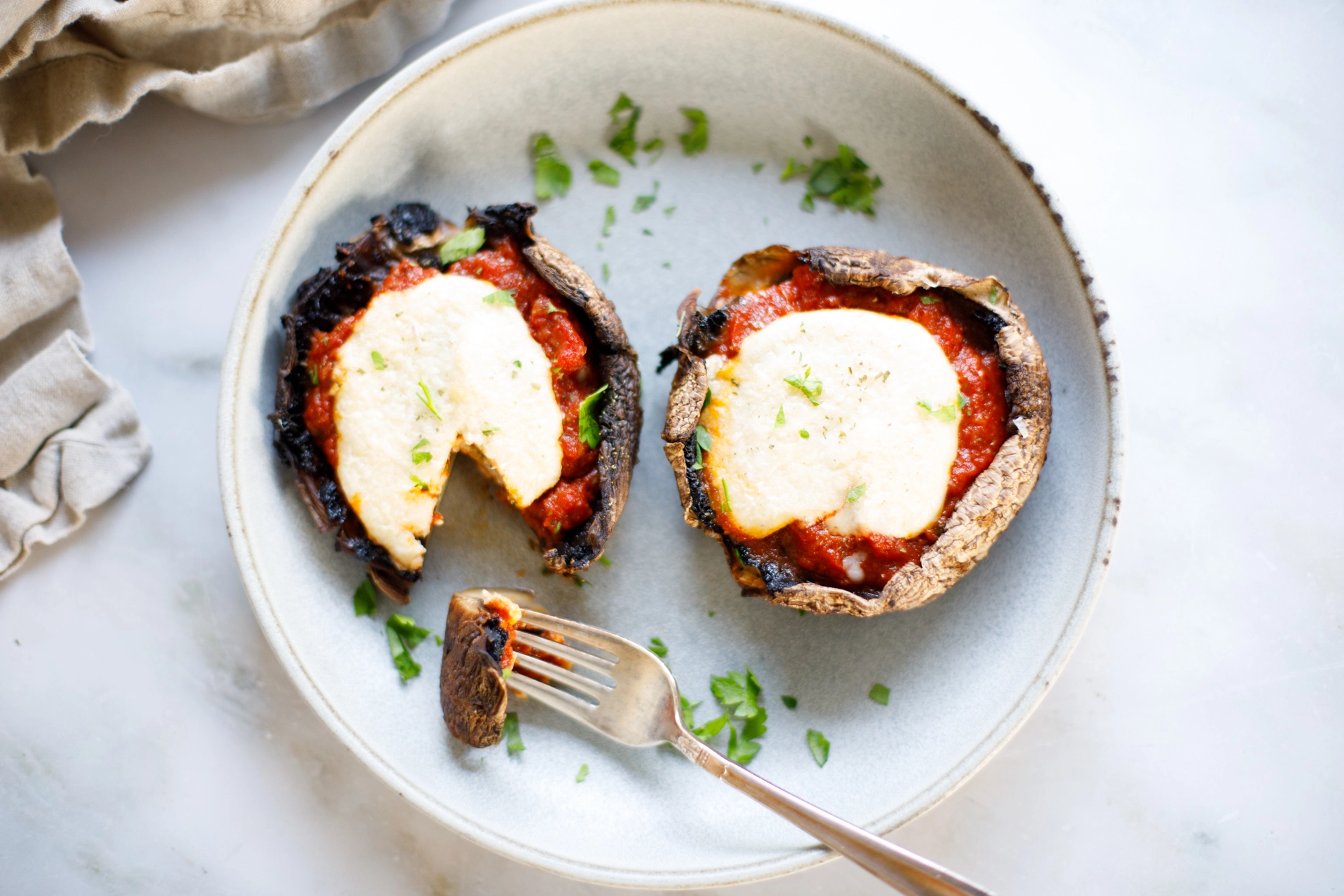 Mushroom Parmigiana overhead on plate