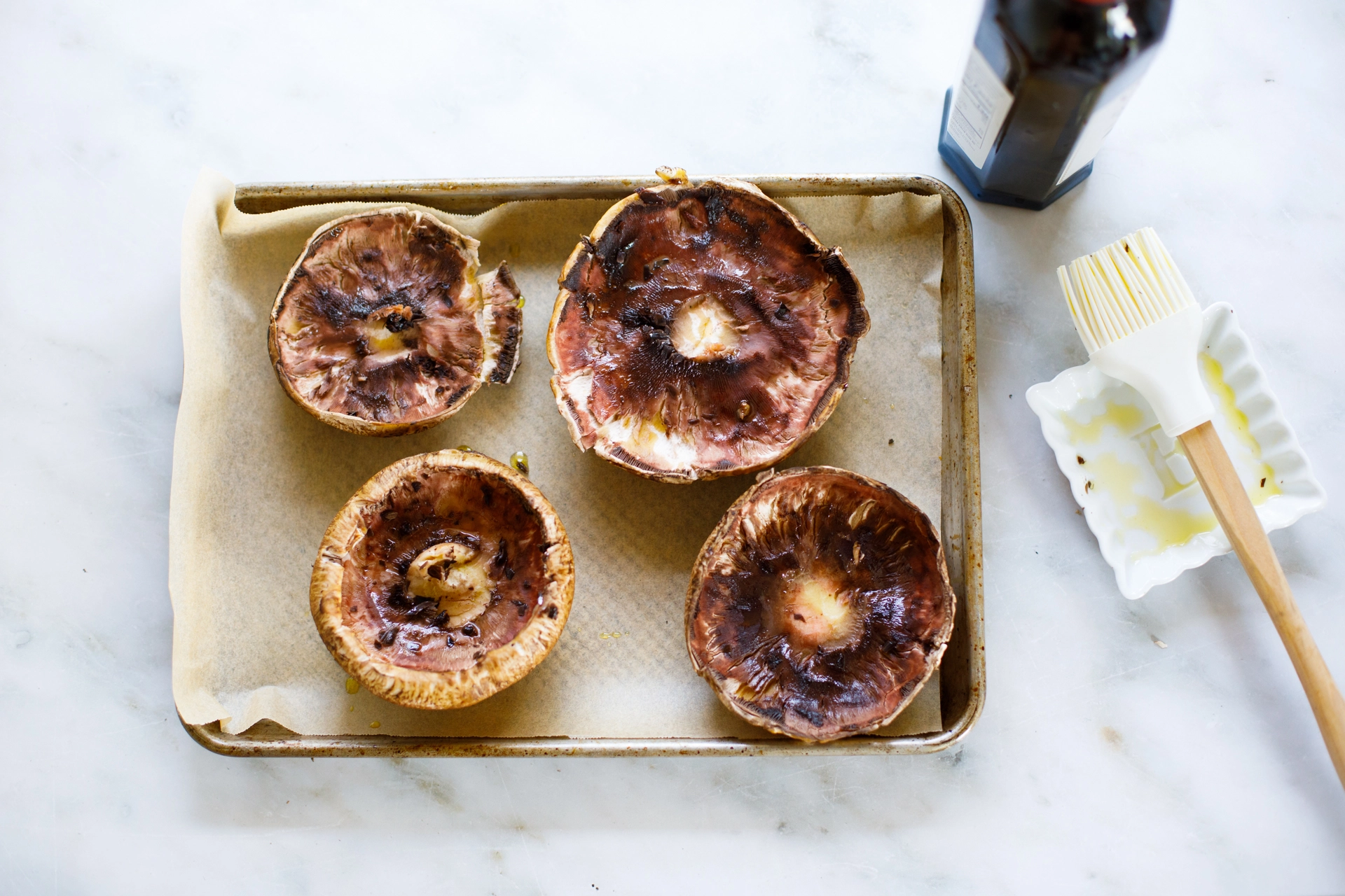 Portobello mushrooms prepped with olive oil