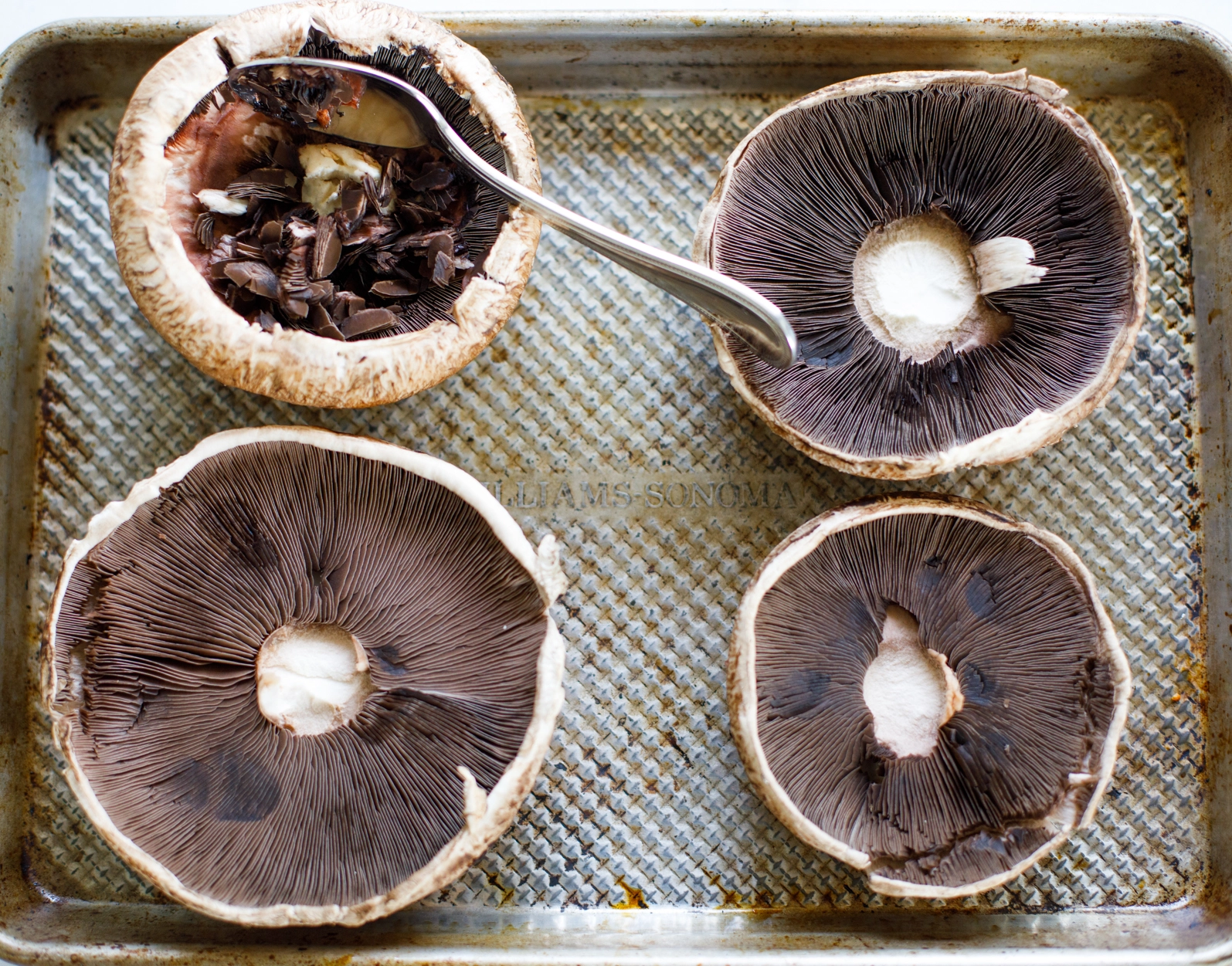 Portobello mushrooms scraping gills image