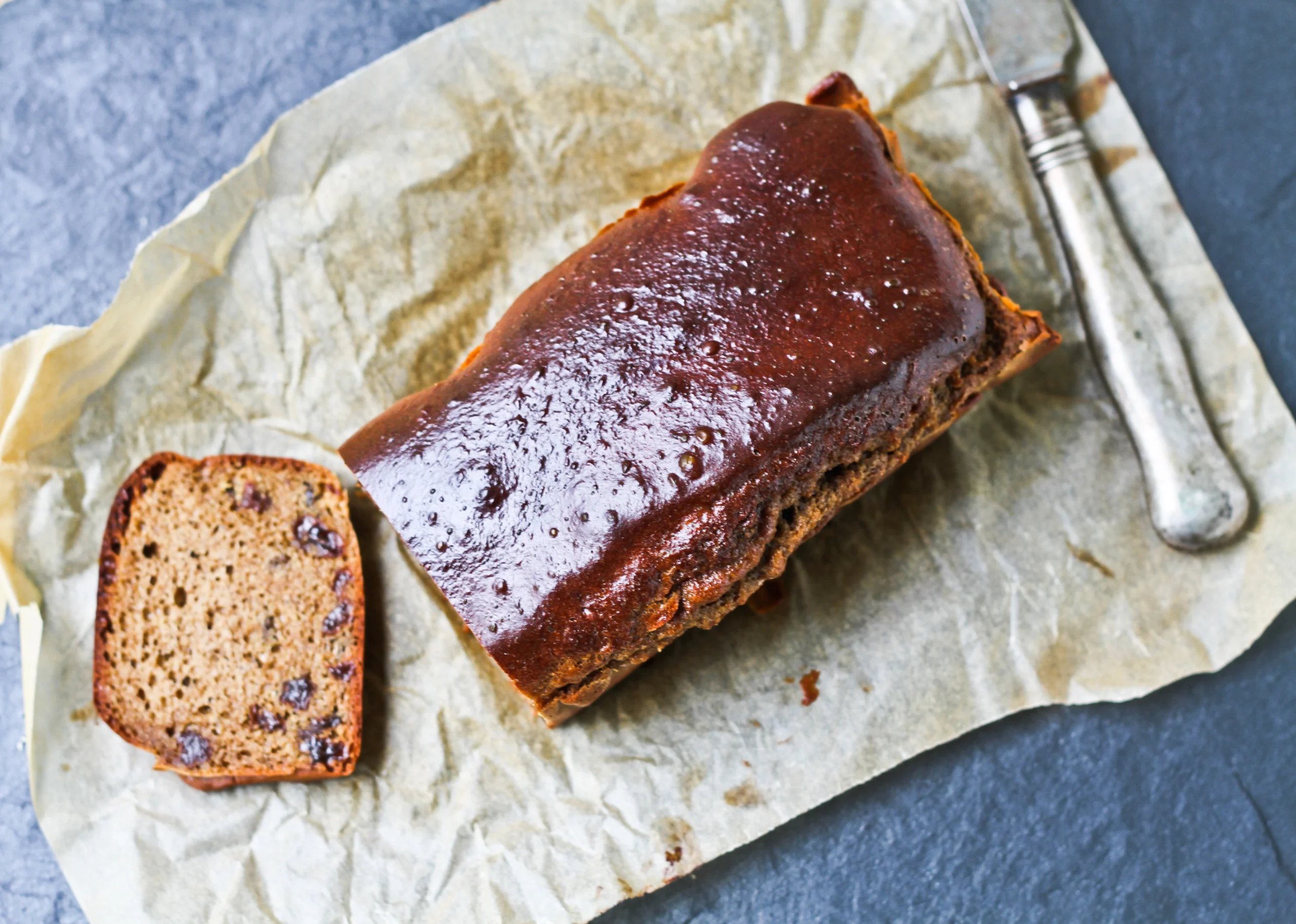 Cinnamon Raisin Bread loaf with slice