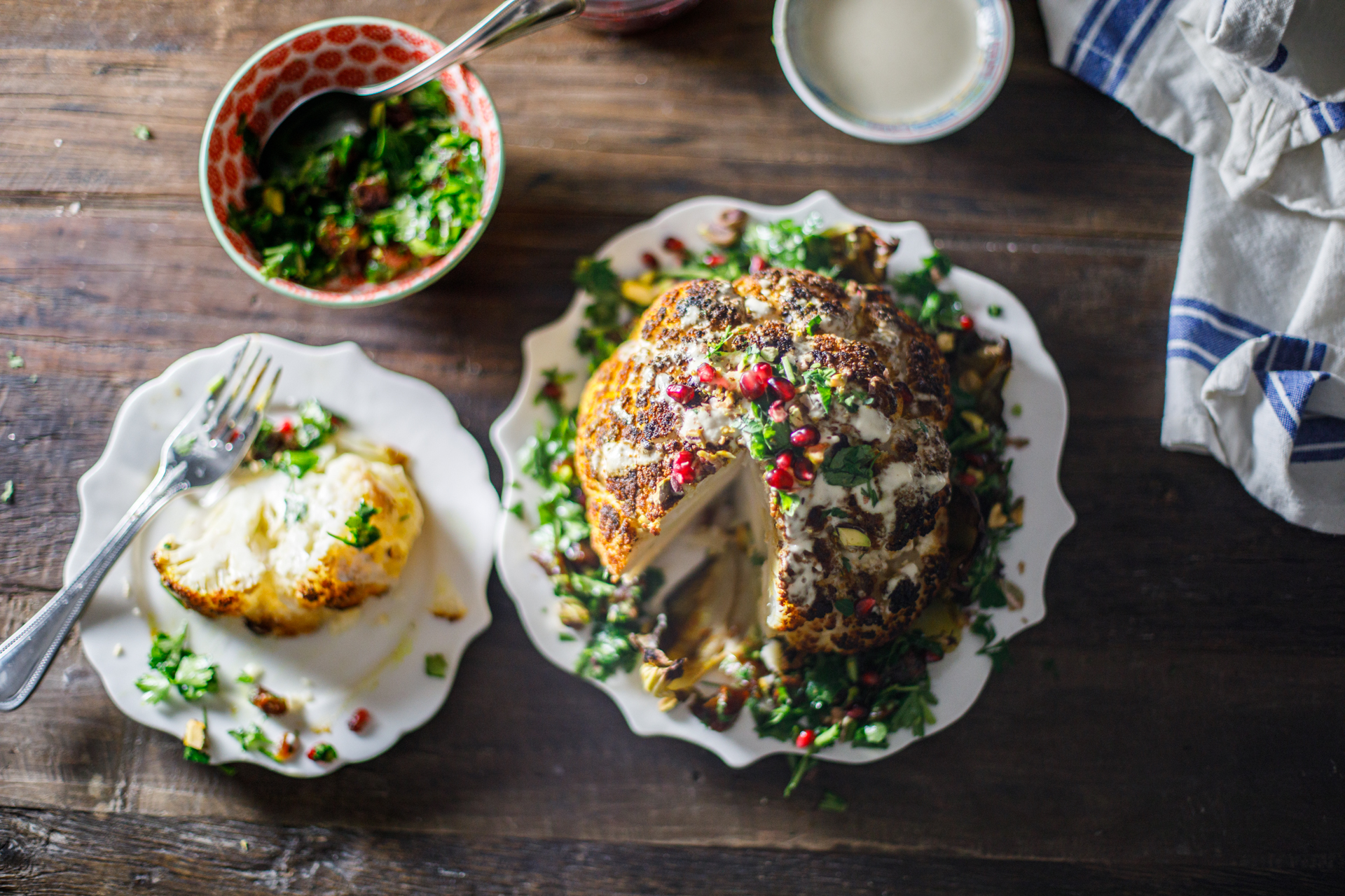 Whole Roasted Cauliflower with slice on plate