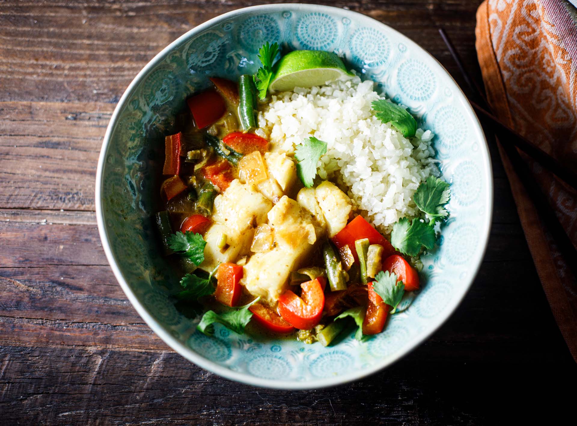 Coconut Lime Fish Curry in a bowl overhead view