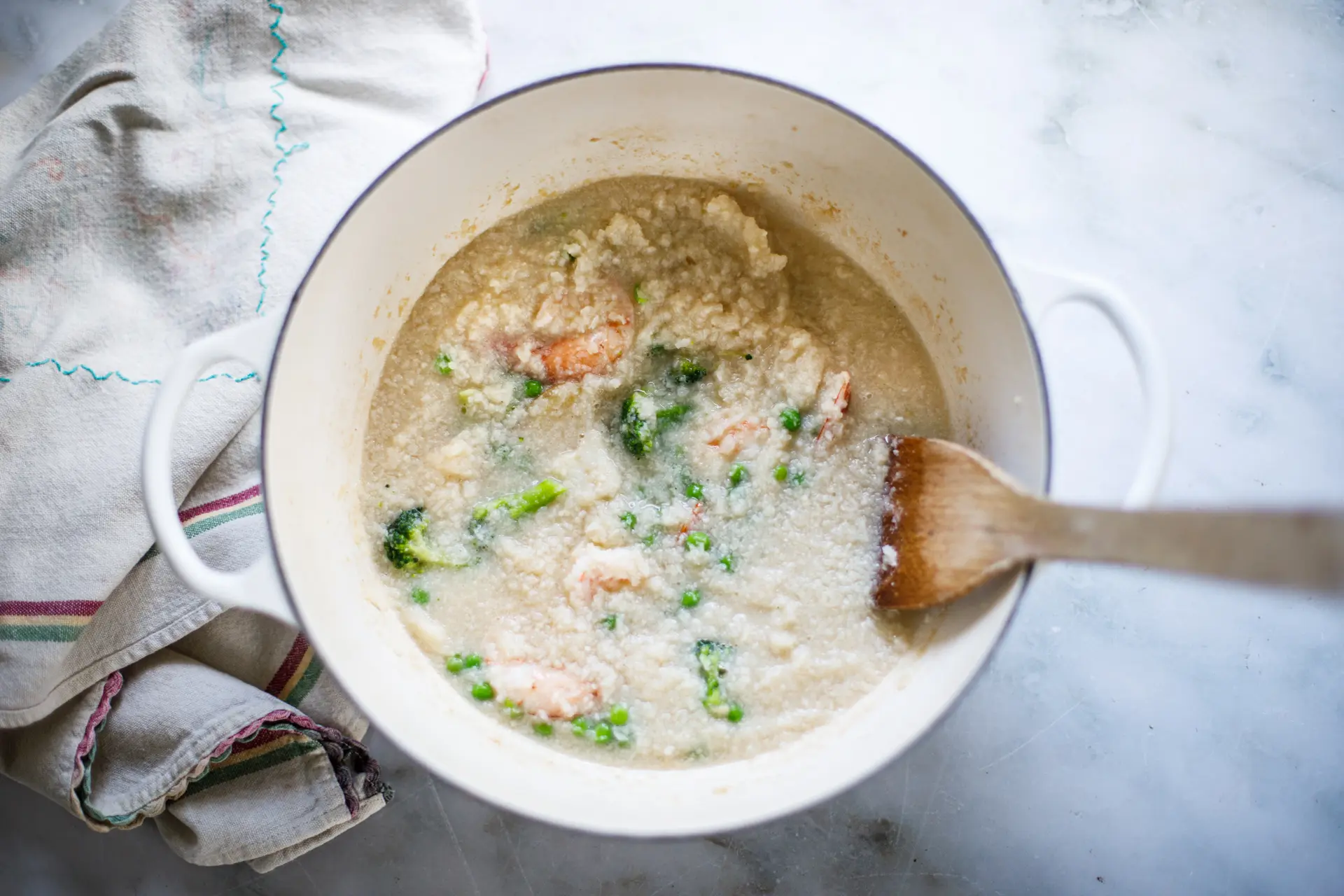 Seafood porridge cooking in stockpot