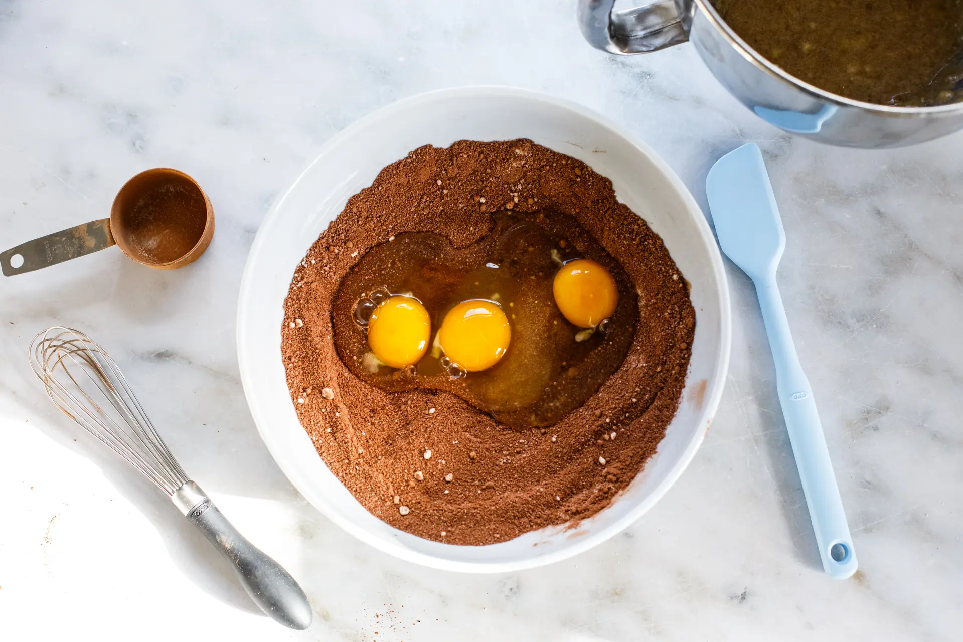 Chocolate Banana Bread batter and eggs in bowl