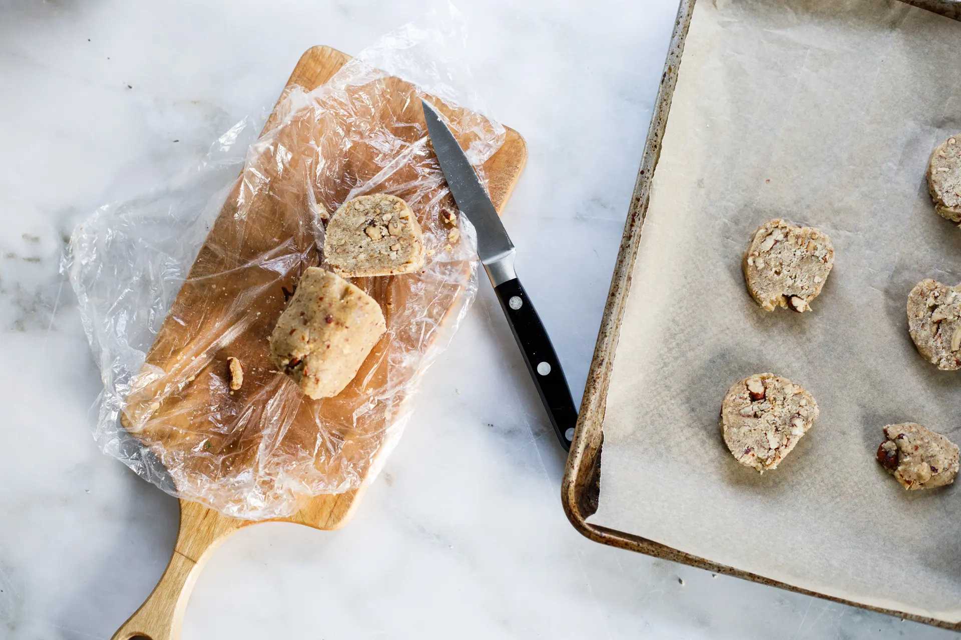 Pecan sandies dough after freezing for an hour, sliced and ready to bake