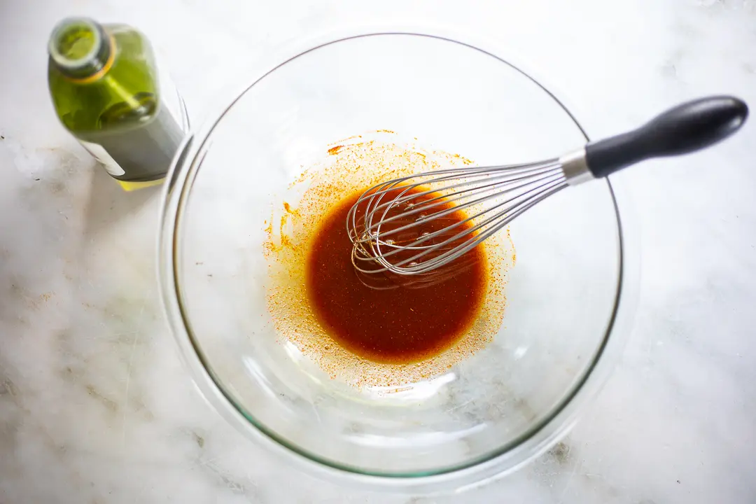 Whisking spices and olive oil