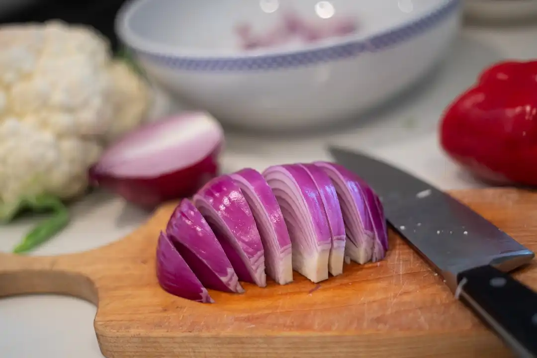Red onion sliced into thin wedges
