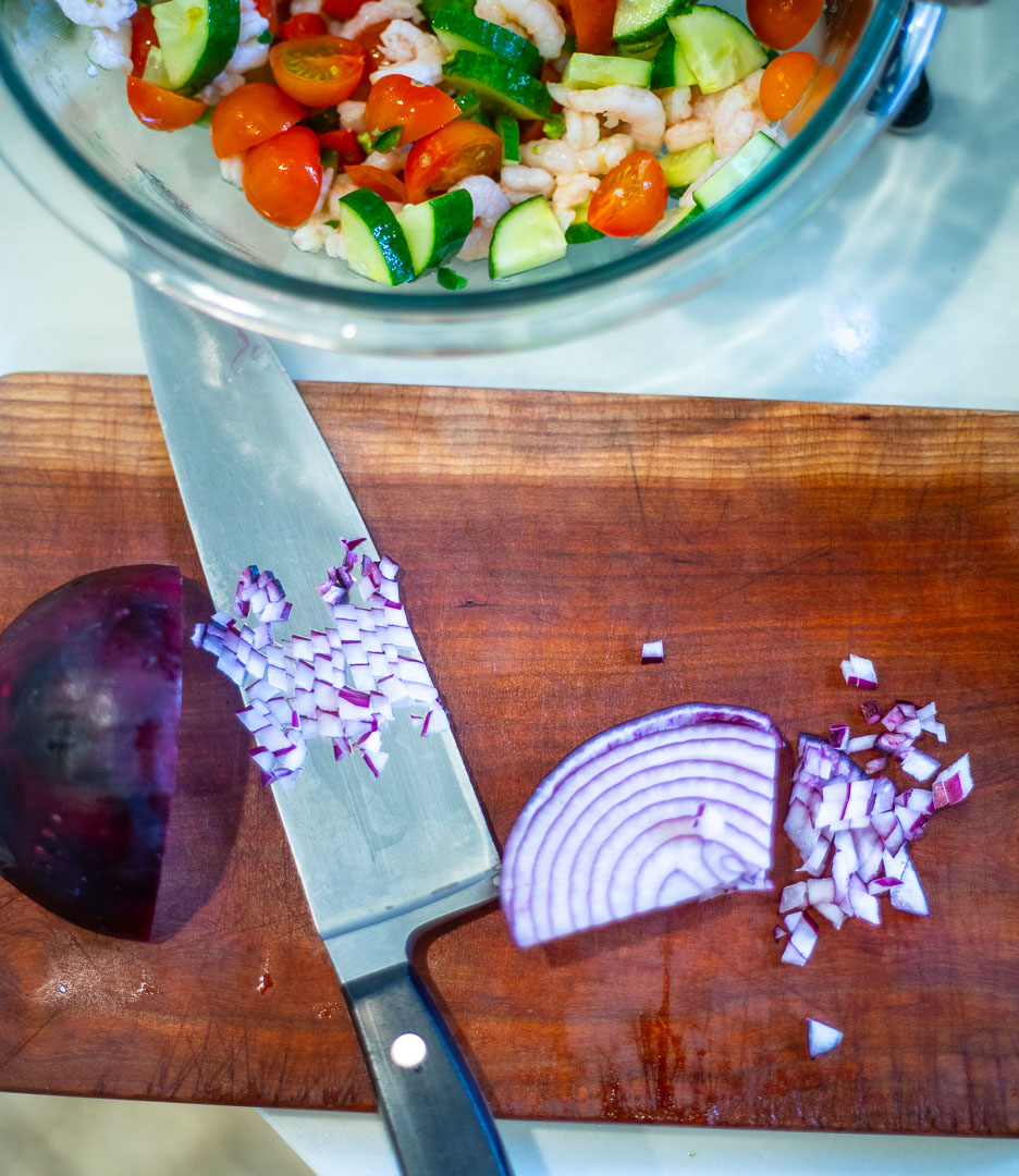 onions chopped finely on cutting board